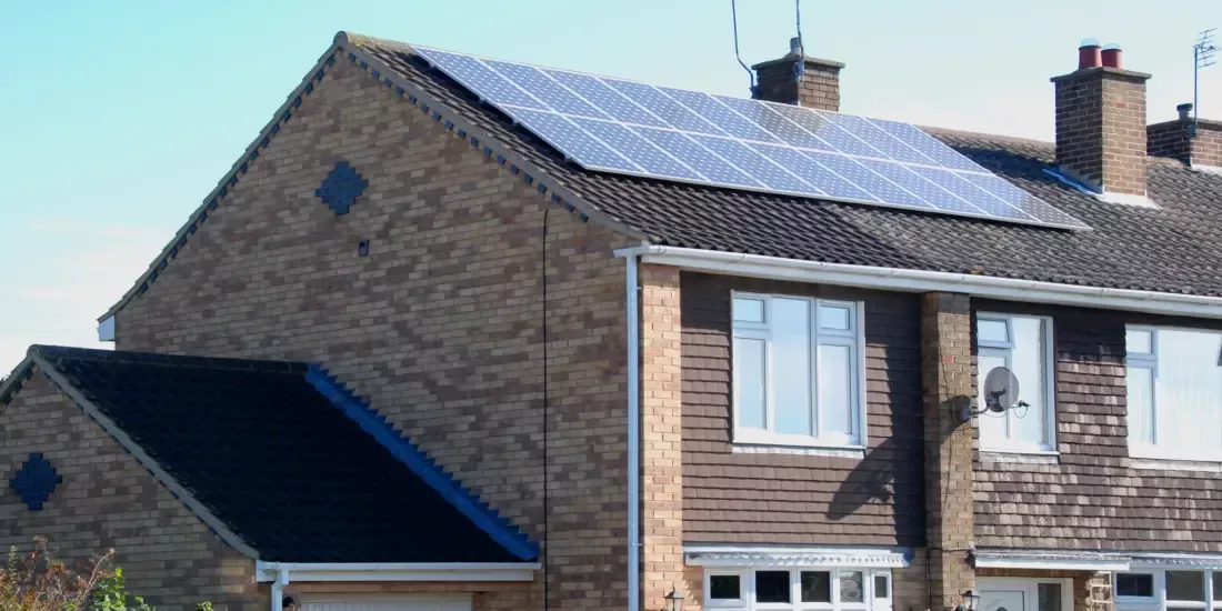 A semi-detached house with solar panels installed on the roof