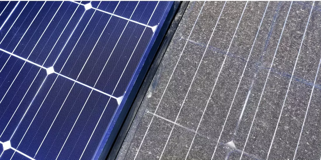 A clean and heavily soiled solar panel sitting side by side