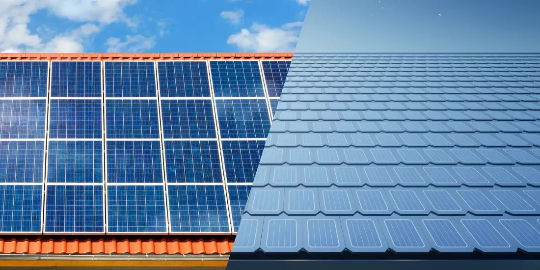 Half an image of a roof with solar panels and one with solar roof tiles