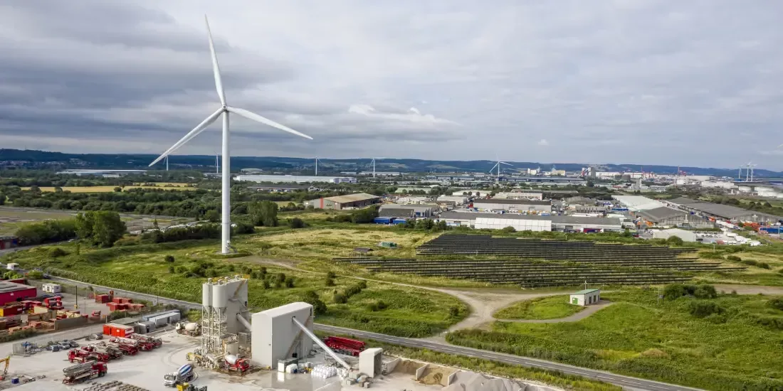 The wind turbine in Avonmouth industrial estate, accompanied by solar farms