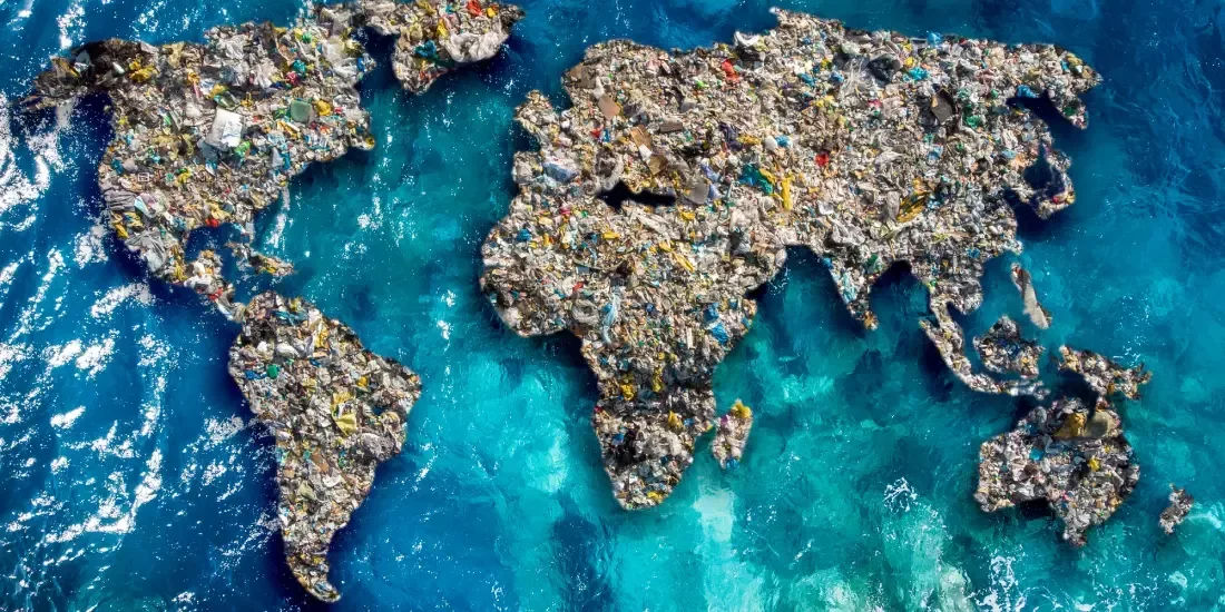 Plastic pollution on water in the shape of the world's continents