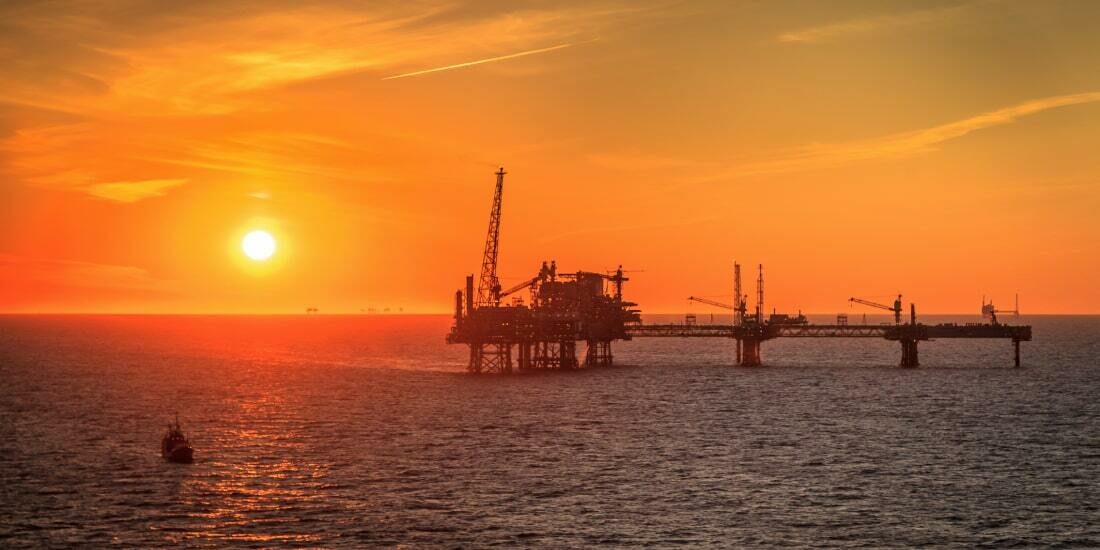An oil rig on the North Sea at sunset