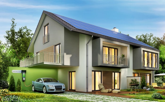 Eco home with solar panels and electric vehicle charging station.